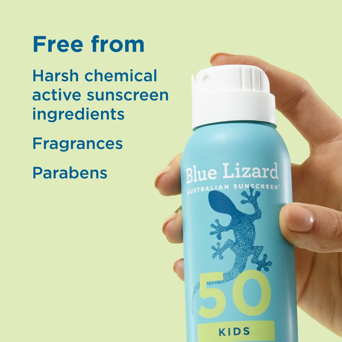 Hand holding a Blue Lizard kids SPF 50 mineral sunscreen spray can with text highlighting ingredients free from harsh chemicals on light green background